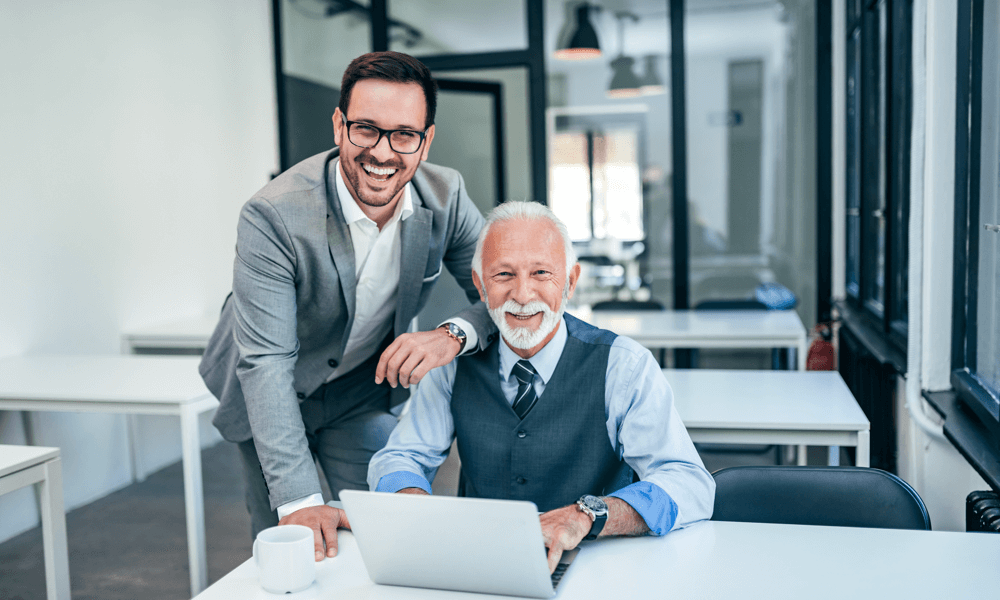 Father and son working together in a family office.