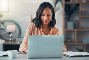 Women smiling and looking at a computer