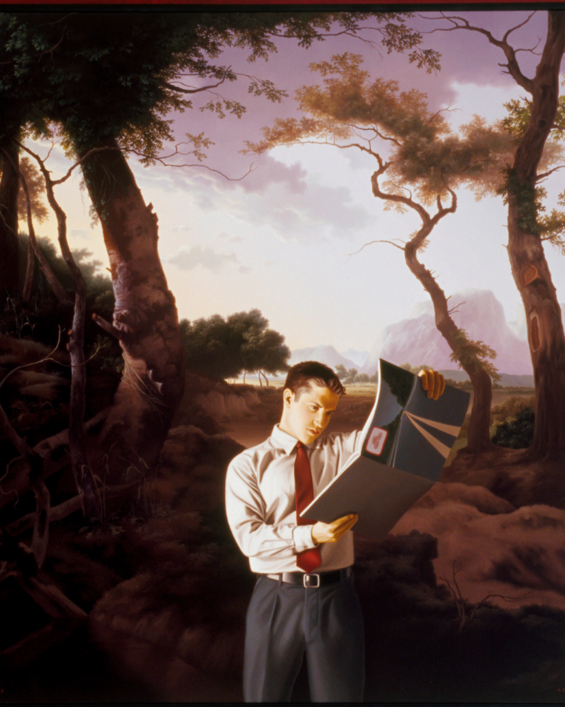 Man holding an envelope in nature.