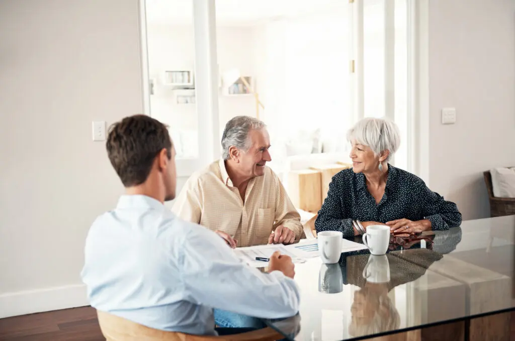 Shot of a senior couple getting advice from their financial consultant at home