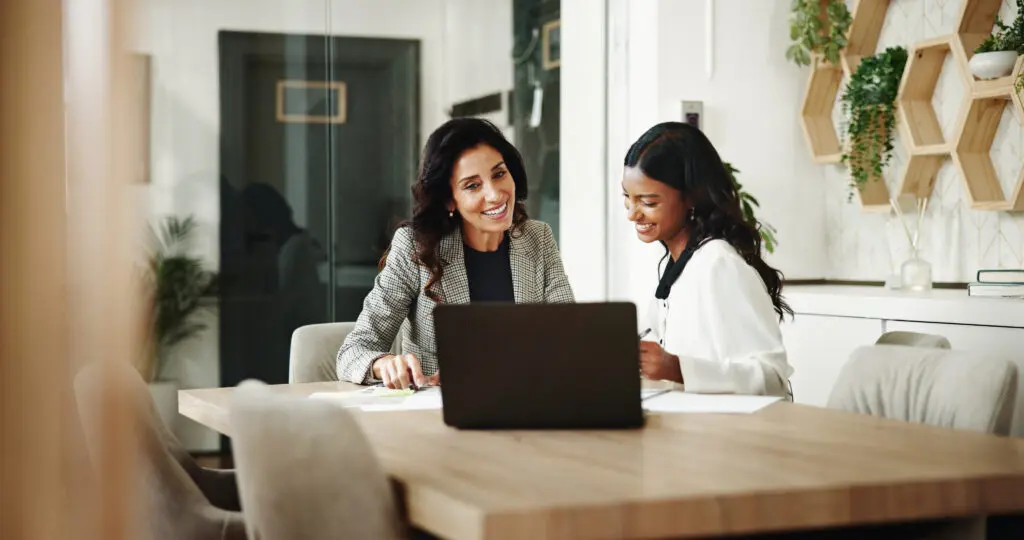 Meeting, women and business people with laptop in office, investment project and discussion. Teamwork, accountant and financial advisor with feedback for finance update, report review and documents