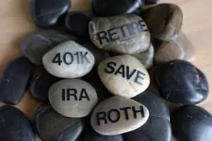 rocks stacked on top of each other with the words retire, 401k, save, IRA, and roth