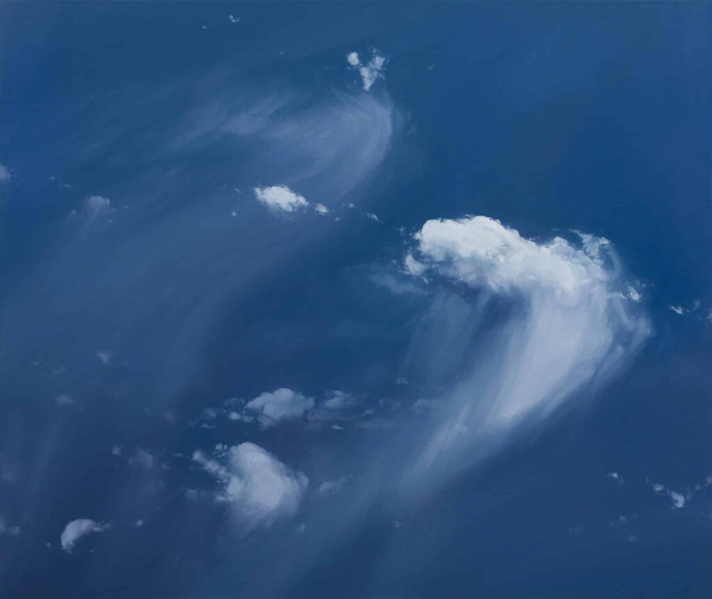 Painting of white clouds in against a blue sky backdrop