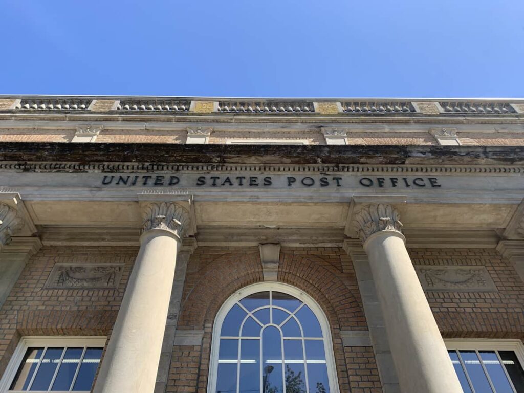 Photo of a building labeled United States Post Office on it