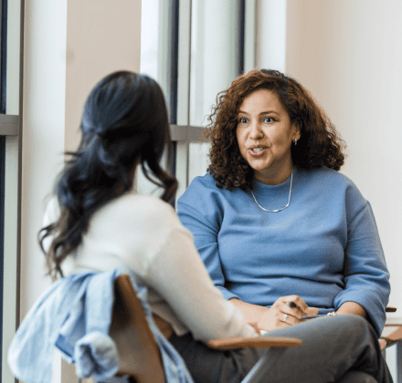 Two women talking in the office