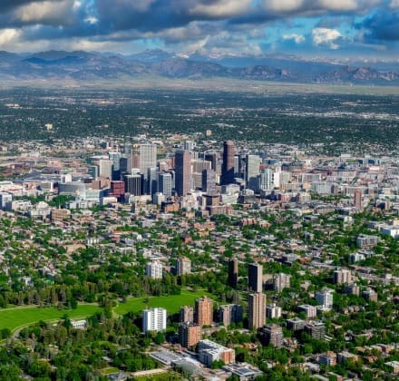 Denver Colorado with mountains in the background and Cheeseman park