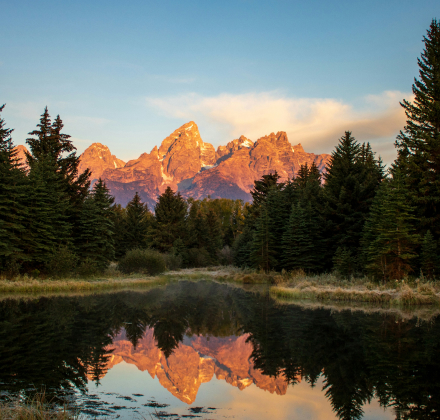 The Grand Teton mountain range in Wyoming with a lake in the foreground