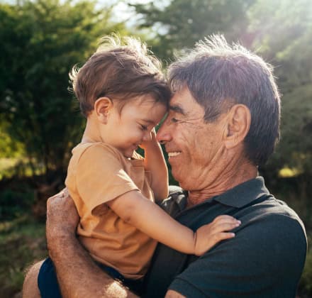 Grandfather and grandson hugging