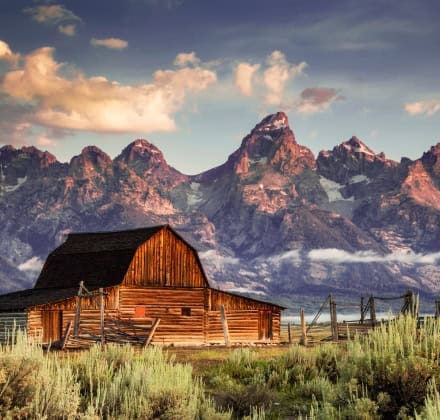 Teton Mountain Range with an abandon cabin in the foreground